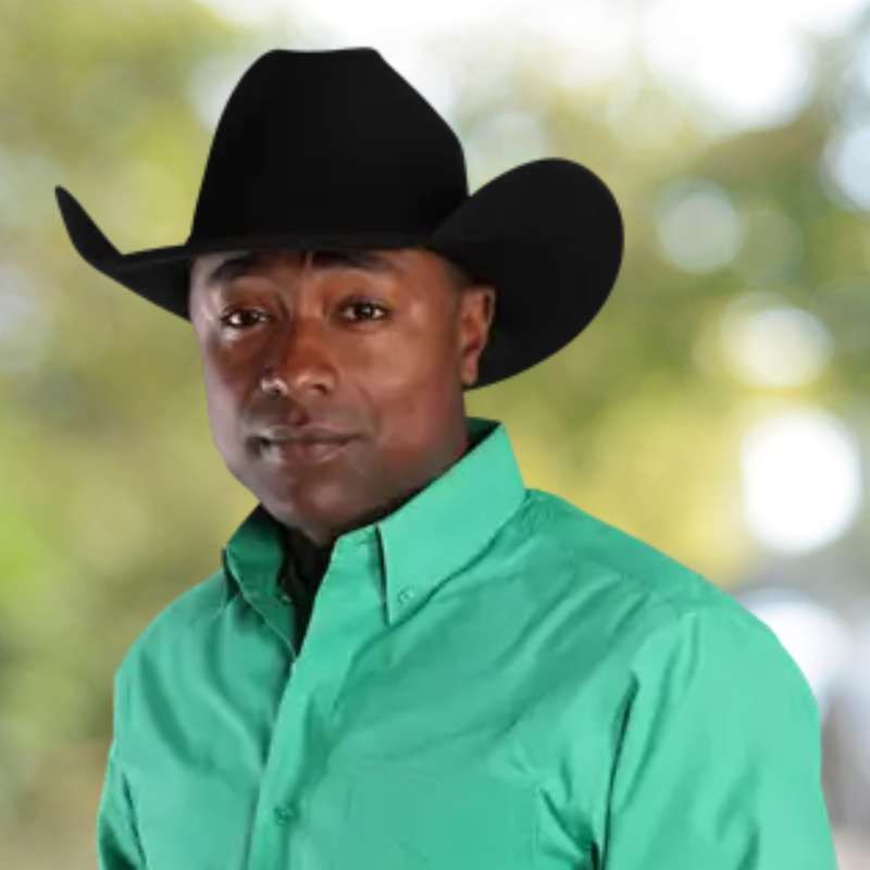 Bull rider Cooper James's headshot is shown. He's wearing a white button up shirt and a tan cowboy hat.
